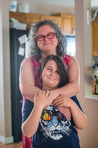 MIKAELA MACKENZIE / WINNIPEG FREE PRESS

Céline Land and her son, Félix (nine), pose for a portrait at home in Winnipeg on Friday, July 23, 2021. For Eva Wasney story.
Winnipeg Free Press 2021.