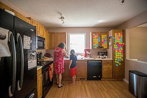 MIKAELA MACKENZIE / WINNIPEG FREE PRESS

Céline Land and her son, Félix (nine), make a summer bruschetta with Vegan Fromagerie feta at home in Winnipeg on Friday, July 23, 2021. For Eva Wasney story.
Winnipeg Free Press 2021.