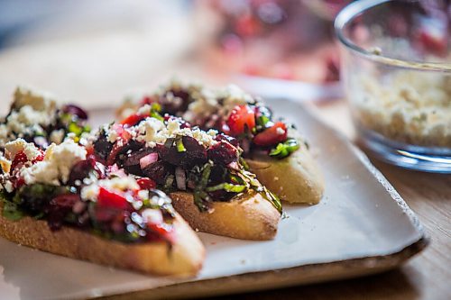 MIKAELA MACKENZIE / WINNIPEG FREE PRESS

Summer bruschetta with Vegan Fromagerie feta at the Land home in Winnipeg on Friday, July 23, 2021. For Eva Wasney story.
Winnipeg Free Press 2021.