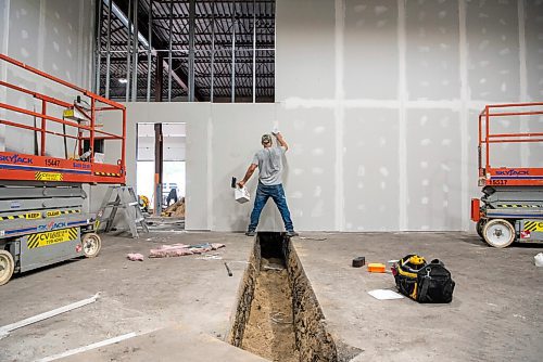 ALEX LUPUL / WINNIPEG FREE PRESS    

A worker is photographed in the space that will eventually become home to Low Life Barrel House in Winnipeg on Wednesday, July 21, 2021. 

Reporter: Ben Sigurdson