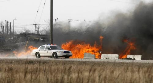 MIKE.DEAL@FREEPRESS.MB.CA 100409 - Friday, April 9th, 2010 A Winnipeg Police Service car approaches a grass fire that got very close to some parked railway cars including a diesel engine along the edges of the CPR North Transcona Railyards between Springfield Road and Bluecher Road. MIKE DEAL / WINNIPEG FREE PRESS