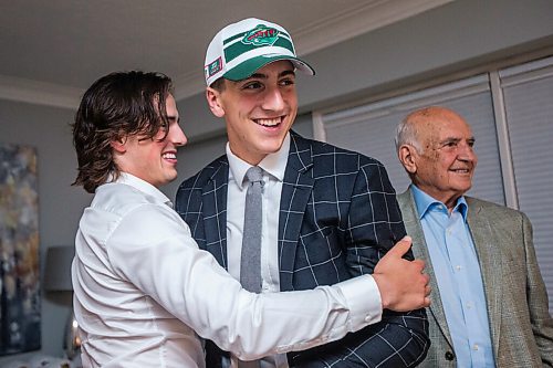 MIKAELA MACKENZIE / WINNIPEG FREE PRESS

Carson Lambos and his family (brother Johnny Lambos, left, and grandpa John Lambos) celebrate his draft pick in their home in Winnipeg on Friday, July 23, 2021. For Mike story.
Winnipeg Free Press 2021.