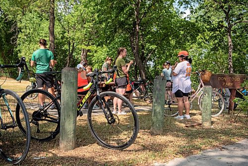 ALEX LUPUL / WINNIPEG FREE PRESS    

Cyclists taking part in the Tour de Glace, a 20-kilometre recreational event which makes four stops at local ice cream shops, enjoy their ice cream in the shade at Don Togo Park in Winnipeg on Saturday, July 24, 2021.