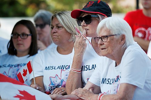 JOHN WOODS / WINNIPEG FREE PRESS
Eleanor Mislawchuck, mother, centre, and Josephine Leddy, grandmother, right, of Canadian Triathlete Tyler Mislawchuck anxiously watch him race at the Tokyo Olympics at his parents house in Oak Bluff Sunday, July 25, 2021. 

Reporter: Sawatzky