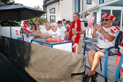 JOHN WOODS / WINNIPEG FREE PRESS
Family and friends and grandmother, Josephine Leddy, centre, of Canadian Triathlete Tyler Mislawchuck gather at his parents house in Oak Bluff to watch him race at the Tokyo Olympics Sunday, July 25, 2021. 

Reporter: Sawatzky