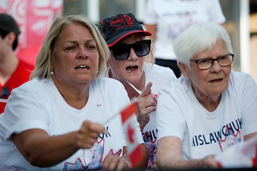 JOHN WOODS / WINNIPEG FREE PRESS
Kim Horrox, family friend, left, Eleanor Mislawchuck, mother, centre, and Josephine Leddy, grandmother, right, of Canadian Triathlete Tyler Mislawchuck anxiously watch him race at the Tokyo Olympics at his parents house in Oak Bluff Sunday, July 25, 2021. 

Reporter: Sawatzky