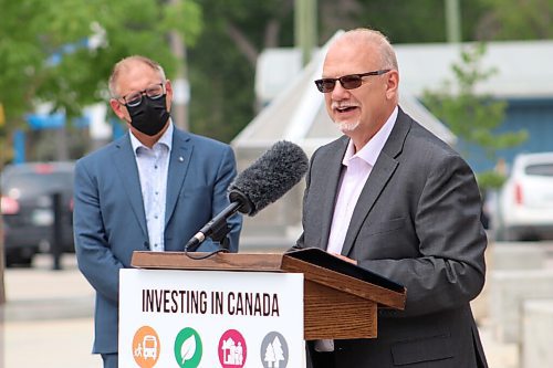 Grant Burr / Winnipeg Free Press
Steinbach Mayor Earl Funk looks on as Steinbach MLA Kelvin Goertzen announces $17.5 million in funding from the provincial and federal governments to support the construction of the $42.5 million Southeast Events Centre in Steinbach on Monday, July 26, 2021.