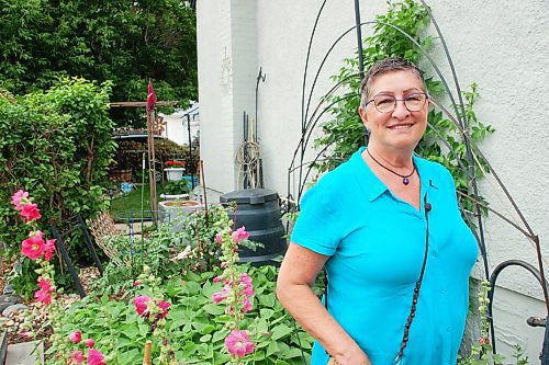 Canstar Community News Joan Boone, pictured in her St. Vital garden, wants to publicly thank old friends Barbara and Marion Cullen, who planted the garden for her while Boone was recovering from an illness.