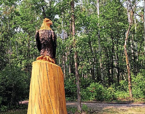 Canstar Community News A carved eagle after the fourth hole at Rivers Edge Golf Course in Beausejour reminds golfers that they're being watched to see if they're honest.