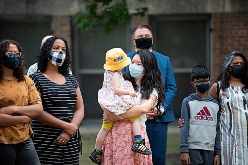 ALEX LUPUL / WINNIPEG FREE PRESS  

Jennifer Chen, a concerned parent, is photographed holding her daughter outside of Riverview School in Winnipeg on Tuesday, July, 27, 2021.

Reporter: Carol Sanders