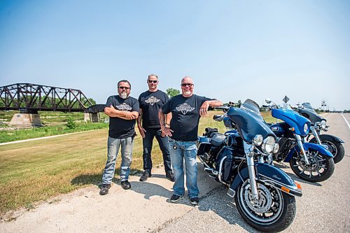 MIKAELA MACKENZIE / WINNIPEG FREE PRESS

Kirk Van Alstyne (left), Moe Sabourin, and Ed Johner, motorcycling enthusiasts who co-founded and organize the Manitoba Motorcycle Ride for Dad, pose for a portrait with their bikes in Headingley on Tuesday, July 27, 2021. For Aaron Epp story.
Winnipeg Free Press 2021.