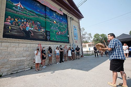 JOHN WOODS / WINNIPEG FREE PRESS
Cory Campbell, Neecheewam's executive director, drums for the Manitoba Advocate for Children and Youths Youth Ambassador Advisory Squad (YAAS!) as they unveil their first mural created as part of The Re-Right Project Tuesday, July 27, 2021 on the side of Neecheewam's building. 

Reporter: Brown