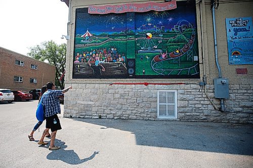 JOHN WOODS / WINNIPEG FREE PRESS
Cory Campbell, Neecheewam's executive director, looks at the Manitoba Advocate for Children and Youths Youth Ambassador Advisory Squad (YAAS!) first mural created as part of The Re-Right Project Tuesday, July 27, 2021 on the side of Neecheewam's building. 

Reporter: Brown