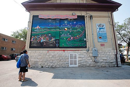 JOHN WOODS / WINNIPEG FREE PRESS
Cory Campbell, Neecheewam's executive director, looks at the Manitoba Advocate for Children and Youths Youth Ambassador Advisory Squad (YAAS!) first mural created as part of The Re-Right Project Tuesday, July 27, 2021 on the side of Neecheewam's building. 

Reporter: Brown