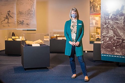 MIKAELA MACKENZIE / WINNIPEG FREE PRESS
Andrea Klassen, curator of the Mennonites at War exhibit, poses for a portrait at the Mennonite Heritage Village Museum in Steinbach on Tuesday, July 27, 2021. For Brenda story.
Winnipeg Free Press 2021.