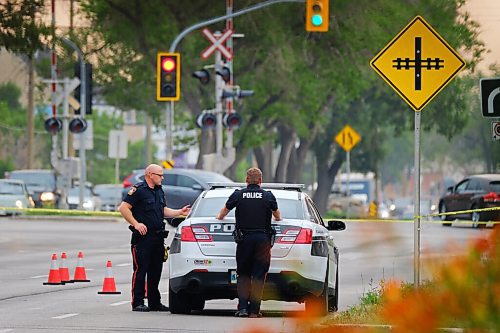 MIKE DEAL / WINNIPEG FREE PRESS
Police guard evidence markers on eastbound Provencher Blvd close to Des Meurons where they are investigating a serious crime that occurred overnight. Traffic on Provencher Boulevard was blocked in both directions between Des Meurons and Langevin streets as of 6:30 a.m. as officers investigate.
20210728 - Wednesday, July 28, 2021