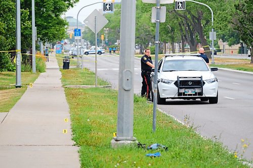 MIKE DEAL / WINNIPEG FREE PRESS
Police guard evidence markers on eastbound Provencher Blvd close to Des Meurons where they are investigating a serious crime that occurred overnight. Traffic on Provencher Boulevard was blocked in both directions between Des Meurons and Langevin streets as of 6:30 a.m. as officers investigate.
20210728 - Wednesday, July 28, 2021