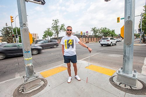 MIKAELA MACKENZIE / WINNIPEG FREE PRESS

Tyler Sneesby poses for a portrait at the intersection of Broadway and Maryland, where the audio sounds for visually impaired folks were mixed up (and telling the person to walk into traffic instead of in the direction of traffic) for months, in Winnipeg on Wednesday, July 28, 2021. For Kevin story.
Winnipeg Free Press 2021.