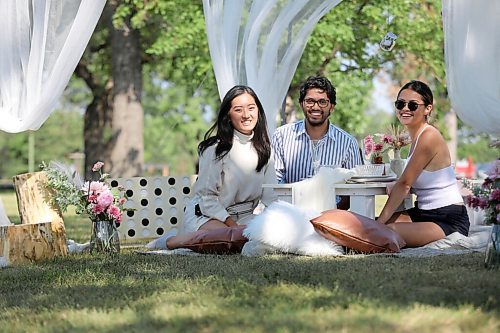 RUTH BONNEVILLE / WINNIPEG FREE PRESS

Local -  Biz or standup

Business partners, Christine Nguyen (left) and An Doan (right) discuss their formal launch to their upscale picnic business called Canopy_Picnic, with Christine's boyfriend, Zandir Narrandes under their canopy at Assiniboine Park Wednesday.  

After taking promo photos of their setup display (formal tableware, cushions, flowers, games and canopy), they decided to sit down at their picnic table and have a business meeting when noticed by FP photog.  

Please contact An Doan for more info.  Info in email to photo desk.


July 28, 2021

