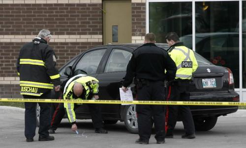 MIKE.DEAL@FREEPRESS.MB.CA 100415 - Thursday, April 15th, 2010 Winnipeg Police and Fire Paramedics at the scene of an accident at the Dakota House seniors complex. It is believed that a man who lives in an apartment here hit then drove over another man who other residents could not confirm lived there. Fire Paramedics on the scene didn't know the condition the injured man who was taken to hospital. See Julie Carl story. MIKE DEAL / WINNIPEG FREE PRESS