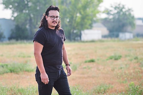 MIKAELA MACKENZIE / WINNIPEG FREE PRESS

Darian McKinney poses for a portrait on the site of the St. Boniface Industrial School (this would have been the back yard area behind the school) in Winnipeg on Thursday, July 29, 2021. For Dylan story.
Winnipeg Free Press 2021.