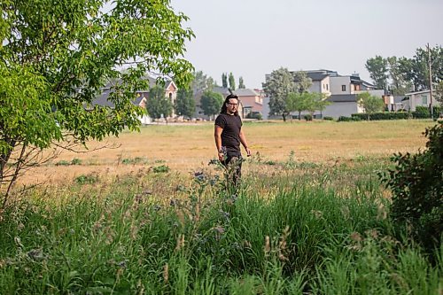 MIKAELA MACKENZIE / WINNIPEG FREE PRESS

Darian McKinney poses for a portrait on the site of the St. Boniface Industrial School (this would have been the back yard area behind the school) in Winnipeg on Thursday, July 29, 2021. For Dylan story.
Winnipeg Free Press 2021.