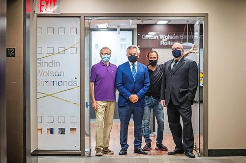 MIKAELA MACKENZIE / WINNIPEG FREE PRESS

Jeff Gindin (left), Richard Wolson, Saul Simmonds, and Evan Roitenberg pose for a photo at their criminal law firm, which is splitting up after 25 years in business, in Winnipeg on Friday, July 30, 2021. For Dean story.
Winnipeg Free Press 2021.