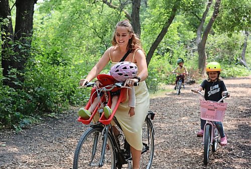 RUTH BONNEVILLE / WINNIPEG FREE PRESS

Standup - Family cycle

Tori Jones cycles with her youngest daughter Poppy Lafreniere (21/2) asleep in her child carrier while her older children, son - Bently (41/2) and daughter Miley (81/2) ride along next to them on the paths along Bunns Creek Friday. 
Note: All the kids have Lafreniere as their last name. 

July 30, 2021
