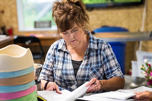 MIKAELA MACKENZIE / WINNIPEG FREE PRESS

Judy Stearns writes feeding notes at Black Bear Rescue Manitoba near Stonewall on Wednesday, July 7, 2021. For Eva Wasney story.
Winnipeg Free Press 2021.