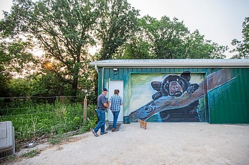 MIKAELA MACKENZIE / WINNIPEG FREE PRESS

Judy and Roger Stearns head into the bear enclosure areas at Black Bear Rescue Manitoba near Stonewall on Wednesday, July 7, 2021. For Eva Wasney story.
Winnipeg Free Press 2021.