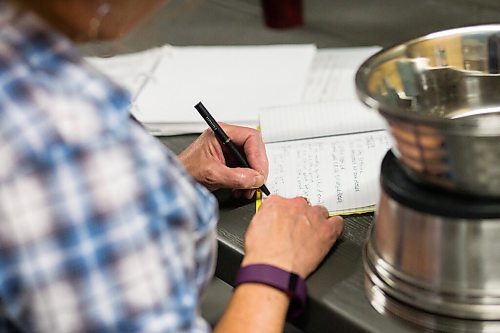 MIKAELA MACKENZIE / WINNIPEG FREE PRESS

Judy Stearns writes feeding notes at Black Bear Rescue Manitoba near Stonewall on Wednesday, July 7, 2021. For Eva Wasney story.
Winnipeg Free Press 2021.