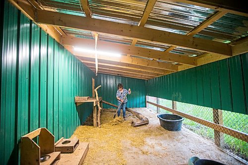 MIKAELA MACKENZIE / WINNIPEG FREE PRESS

Judy Stearns cleans out one of the intermediate enclosures at Black Bear Rescue Manitoba near Stonewall on Wednesday, July 7, 2021. For Eva Wasney story.
Winnipeg Free Press 2021.