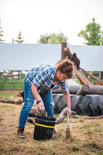 MIKAELA MACKENZIE / WINNIPEG FREE PRESS

Judy Stearns cleans an enclosure at Black Bear Rescue Manitoba near Stonewall on Wednesday, July 7, 2021. For Eva Wasney story.
Winnipeg Free Press 2021.