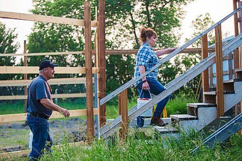 MIKAELA MACKENZIE / WINNIPEG FREE PRESS

Judy and Roger Stearns head out to feed the cubs with buckets of expired produce at Black Bear Rescue Manitoba near Stonewall on Wednesday, July 7, 2021. For Eva Wasney story.
Winnipeg Free Press 2021.