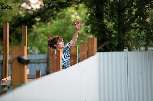 MIKAELA MACKENZIE / WINNIPEG FREE PRESS

Judy Stearns throws expired produce into the enclosure while remaining hidden from the cubs at Black Bear Rescue Manitoba near Stonewall on Wednesday, July 7, 2021. For Eva Wasney story.
Winnipeg Free Press 2021.