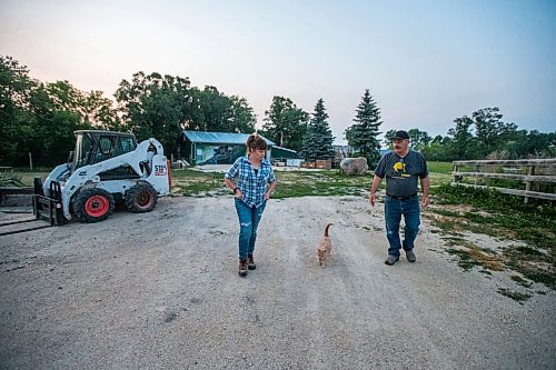 MIKAELA MACKENZIE / WINNIPEG FREE PRESS

Judy and Roger Stearns walk back towards the house at dusk at Black Bear Rescue Manitoba near Stonewall on Wednesday, July 7, 2021. For Eva Wasney story.
Winnipeg Free Press 2021.