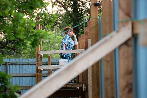 MIKAELA MACKENZIE / WINNIPEG FREE PRESS

Judy Stearns throws expired produce into the enclosure while remaining hidden from the cubs at Black Bear Rescue Manitoba near Stonewall on Wednesday, July 7, 2021. For Eva Wasney story.
Winnipeg Free Press 2021.