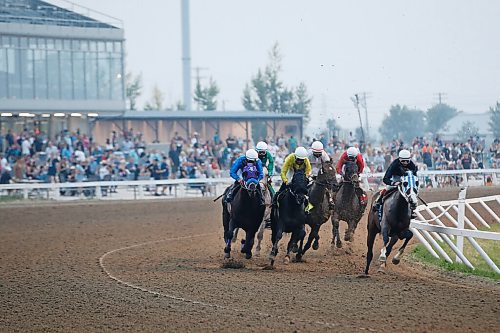 JOHN WOODS / WINNIPEG FREE PRESS
Horses round the first bend in race three with fans in the stands at Manitoba Derby day at the Assiniboia Downs Monday, August 2, 2021. 

Reporter: ?