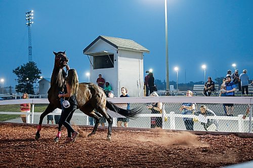 JOHN WOODS / WINNIPEG FREE PRESS
People look at the horses for race five in the paddock at Manitoba Derby day at the Assiniboia Downs Monday, August 2, 2021. 

Reporter: ?