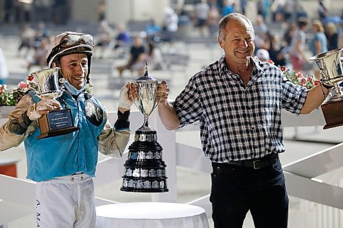 JOHN WOODS / WINNIPEG FREE PRESS
Alexander Marti riding Uncharacteristic (5) and trainer Robert VanOverschot, right, are photographed after winning the Manitoba Derby at Assiniboia Downs Monday, August 2, 2021. 

Reporter: ?