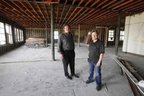 BORIS.MINKEVICH@FREEPRESS.MB.CA  100418 BORIS MINKEVICH / WINNIPEG FREE PRESS Mark and Rick Hofer pose for a photo in the Avenue Building on Portage Ave.  They are converting it to downtown rental apartments.