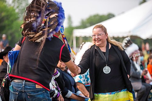 MIKAELA MACKENZIE / WINNIPEG FREE PRESS

Assembly of First Nations regional chief Cindy Woodhouse shakes hands after speaking at a commemoration of the 150th anniversary of the making of Treaty No. 1 at the Lower Fort Garry National Historic Site on Tuesday, Aug. 3, 2021. For Gabrielle Piche story.
Winnipeg Free Press 2021.