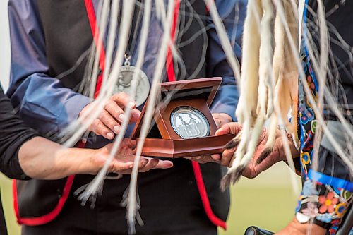 MIKAELA MACKENZIE / WINNIPEG FREE PRESS

Chief Derrick Henderson accepts a treaty medal at a commemoration of the 150th anniversary of the making of Treaty No. 1 at the Lower Fort Garry National Historic Site on Tuesday, Aug. 3, 2021. For Gabrielle Piche story.
Winnipeg Free Press 2021.