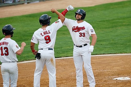 JOHN WOODS / WINNIPEG FREE PRESS
Winnipeg Goldeye Kyle Martin (33) celebrates with Max Murphy (13) and Tyler Hill (9) after hitting them in with a homerun during their game against the Sioux City Explorers Tuesday, August 3, 2021. 

Reporter: SAwtzky