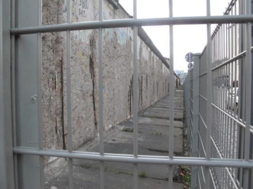 Photo's of Berlin sent in by Gerald Flood, April 20, 2010 One of few remaining stretches of the Berlin Wall in Berlin city centre is protected by a fence. winnipeg free press