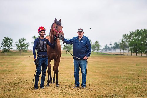 MIKAELA MACKENZIE / WINNIPEG FREE PRESS

Jockey Stanley Chadee Jr. (left) and trainer Murray Duncan pose for a photo with recent R.J. Speers winner Plentiful at the Assiniboia Downs in Winnipeg on Thursday, Aug. 5, 2021. For George Williams story.
Winnipeg Free Press 2021.