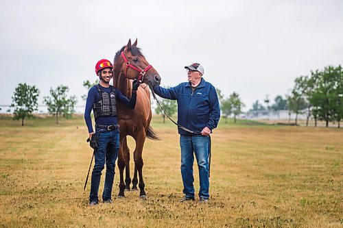 MIKAELA MACKENZIE / WINNIPEG FREE PRESS

Jockey Stanley Chadee Jr. (left) and trainer Murray Duncan pose for a photo with recent R.J. Speers winner Plentiful at the Assiniboia Downs in Winnipeg on Thursday, Aug. 5, 2021. For George Williams story.
Winnipeg Free Press 2021.
