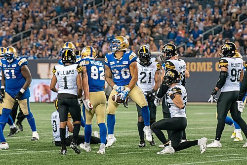 ALEX LUPUL / WINNIPEG FREE PRESS  

Winnipeg Blue Bombers running back Brady Oliveira jumps in the air after picking up a first down at IG Field during the opening game of the 2021 CFL season.