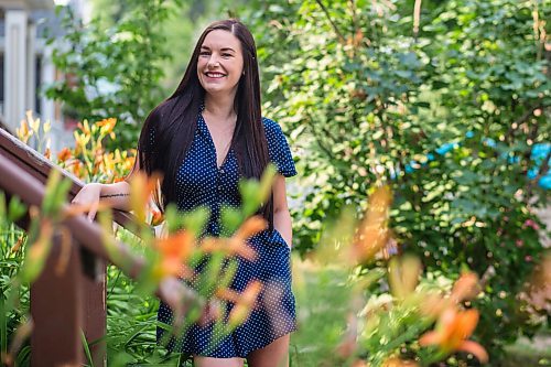 MIKAELA MACKENZIE / WINNIPEG FREE PRESS

Alyson Shane, who volunteered her time helping New Journey Housing staff with their social media and digital marketing strategy, poses for a portrait in her front yard in Winnipeg on Friday, Aug. 6, 2021. For Aaron Epp story.
Winnipeg Free Press 2021.