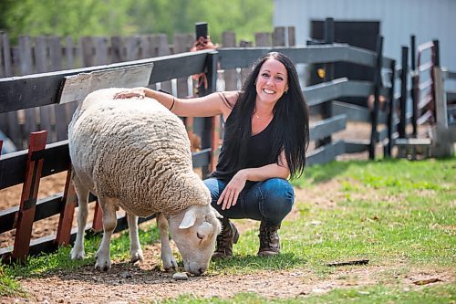 MIKAELA MACKENZIE / WINNIPEG FREE PRESS

Lucy Sloan, registered counsellor and owner of Lil' Steps Wellness Farm, poses for a portrait with Apple the sheep at the farm in St. Malo on Friday, Aug. 6, 2021. For Sabrina story.
Winnipeg Free Press 2021.
